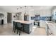 Stylish kitchen features stainless steel appliances, a center island with bar seating, and ample counter space at 6309 Miraloma St, Las Vegas, NV 89108