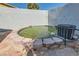 An outdoor koi pond featuring stone detail and landscaping at 6309 Miraloma St, Las Vegas, NV 89108
