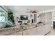 Comfortable living room featuring a sectional sofa, entertainment center, and a view of the backyard at 6309 Miraloma St, Las Vegas, NV 89108