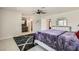 Comfortable main bedroom with ensuite bathroom, neutral walls, modern fan, and patterned rug at 6309 Miraloma St, Las Vegas, NV 89108