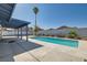 A backyard pool and palm tree at 6309 Miraloma St, Las Vegas, NV 89108