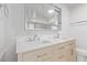 Bright bathroom with double sinks, a vanity with storage, and modern fixtures at 659 D Ave, Boulder City, NV 89005