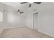 Neutral bedroom with ceiling fan and light carpet at 659 D Ave, Boulder City, NV 89005