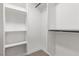 White closet with built-in shelves and hanging rods at 659 D Ave, Boulder City, NV 89005