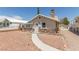 Charming single-story home with a unique stone facade and inviting walkway at 659 D Ave, Boulder City, NV 89005