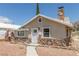 Charming single-story home with a unique stone facade and inviting walkway at 659 D Ave, Boulder City, NV 89005