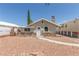 Charming single-story home with a unique stone facade and inviting walkway at 659 D Ave, Boulder City, NV 89005