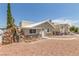Charming single-story home with a unique stone facade and inviting walkway at 659 D Ave, Boulder City, NV 89005