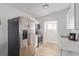 This kitchen features stainless steel appliances, white cabinets, and a marble countertop at 659 D Ave, Boulder City, NV 89005