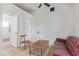Cozy living room with vinyl floors, white walls, and a vintage red sofa at 659 D Ave, Boulder City, NV 89005