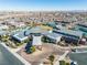 Daytime aerial view of community center with pool, tennis courts, and well-manicured landscaping at 6684 Regency Stone Way, Las Vegas, NV 89148