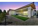 An extended outdoor living space has artificial turf and a gravel yard at 6684 Regency Stone Way, Las Vegas, NV 89148
