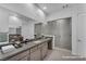 Modern bathroom featuring a large mirror, dual vanity, and walk-in shower at 6684 Regency Stone Way, Las Vegas, NV 89148