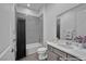 Bathroom featuring tile in shower and vanity at 6684 Regency Stone Way, Las Vegas, NV 89148