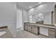 Bathroom with double sink vanity and grey cabinetry at 6684 Regency Stone Way, Las Vegas, NV 89148