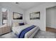 Bedroom featuring neutral color palette and art at 6684 Regency Stone Way, Las Vegas, NV 89148