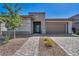 A single-Gathering home displays its well-maintained front yard and inviting entrance at 6684 Regency Stone Way, Las Vegas, NV 89148