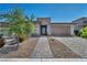 Well maintained single story home with desert landscaping, stone accents and a spacious two-car garage at 6684 Regency Stone Way, Las Vegas, NV 89148