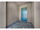 Stylish modern front door with stone tile entry at 6684 Regency Stone Way, Las Vegas, NV 89148
