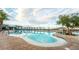 Community pool is surrounded by lounge chairs with mountains and neighborhood features at 6684 Regency Stone Way, Las Vegas, NV 89148