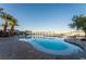 Lush landscaping surrounds a relaxing pool with community center, cabanas, and lounge seating at 6684 Regency Stone Way, Las Vegas, NV 89148