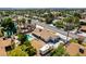 Backyard aerial view of a home with a swimming pool, patio, and recreational vehicle parking, with a well-maintained lawn and mature trees at 6710 Rocking Horse Ave, Las Vegas, NV 89108