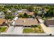 An aerial view showcases a single-Gathering home with a backyard pool and attached garage, complemented by a spacious driveway and lawn at 6710 Rocking Horse Ave, Las Vegas, NV 89108