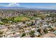 An aerial view featuring a residential area with tree-lined streets, baseball field and houses, highlighting neighborhood amenities and location at 6710 Rocking Horse Ave, Las Vegas, NV 89108