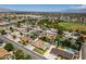 Panoramic aerial showcasing a residential neighborhood with numerous homes, pools, and lush landscaping at 6710 Rocking Horse Ave, Las Vegas, NV 89108
