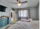 Neutral bedroom features a ceiling fan, window and closet at 6710 Rocking Horse Ave, Las Vegas, NV 89108