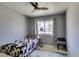 Bedroom with ceiling fan, natural light at 6710 Rocking Horse Ave, Las Vegas, NV 89108