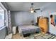 Neutral bedroom features a ceiling fan, window and closet at 6710 Rocking Horse Ave, Las Vegas, NV 89108