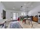 Bright kitchen and dining area with stainless steel appliances, light countertops and white walls at 6710 Rocking Horse Ave, Las Vegas, NV 89108