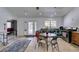 Bright kitchen and dining area with stainless steel appliances, light countertops and white walls at 6710 Rocking Horse Ave, Las Vegas, NV 89108