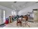 Bright kitchen and dining area with stainless steel appliances, light countertops and white walls at 6710 Rocking Horse Ave, Las Vegas, NV 89108