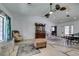 Bright living room featuring neutral walls, ceiling fans and hardwood floors at 6710 Rocking Horse Ave, Las Vegas, NV 89108