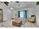 Comfortable living room with neutral walls, ceiling fans and hardwood floors at 6710 Rocking Horse Ave, Las Vegas, NV 89108