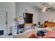 Bright living room featuring a large television, tile floor and view of the kitchen at 6710 Rocking Horse Ave, Las Vegas, NV 89108
