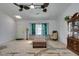 Inviting living room with neutral walls, ceiling fans and hardwood floors at 6710 Rocking Horse Ave, Las Vegas, NV 89108