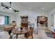 Bright kitchen and dining area with stainless steel appliances, light countertops and white walls at 6710 Rocking Horse Ave, Las Vegas, NV 89108