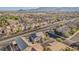 An aerial view of the neighborhood with surrounding houses and scenic mountain views in the distance at 6804 Tropicaire St, Las Vegas, NV 89149