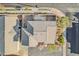 An aerial view showcases the home's roof, nearby landscaping, and neighborhood street layout at 6804 Tropicaire St, Las Vegas, NV 89149