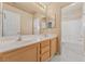 Bright bathroom features double sinks and neutral tiling at 6804 Tropicaire St, Las Vegas, NV 89149