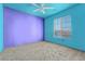 Fun bedroom features a window, ceiling fan, and light-toned carpet at 6804 Tropicaire St, Las Vegas, NV 89149