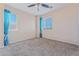 Bright bedroom with neutral walls, soft carpet, and two sunny windows at 6804 Tropicaire St, Las Vegas, NV 89149