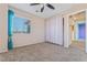 Comfortable bedroom features neutral walls, a window, and soft carpet at 6804 Tropicaire St, Las Vegas, NV 89149