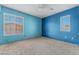Bright bedroom featuring two windows, and soft carpet at 6804 Tropicaire St, Las Vegas, NV 89149