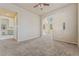 Open floor plan with neutral walls and carpeting and large archway to a room with lots of natural light at 6804 Tropicaire St, Las Vegas, NV 89149