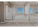 Main bathroom features a glass enclosed shower and separate tub at 6804 Tropicaire St, Las Vegas, NV 89149