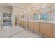 Ensuite bath features dual sinks and lots of countertop space, tub, and shower at 6804 Tropicaire St, Las Vegas, NV 89149